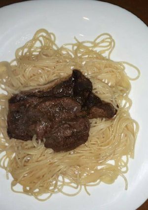 A picture of Spaghetti served with steak.
