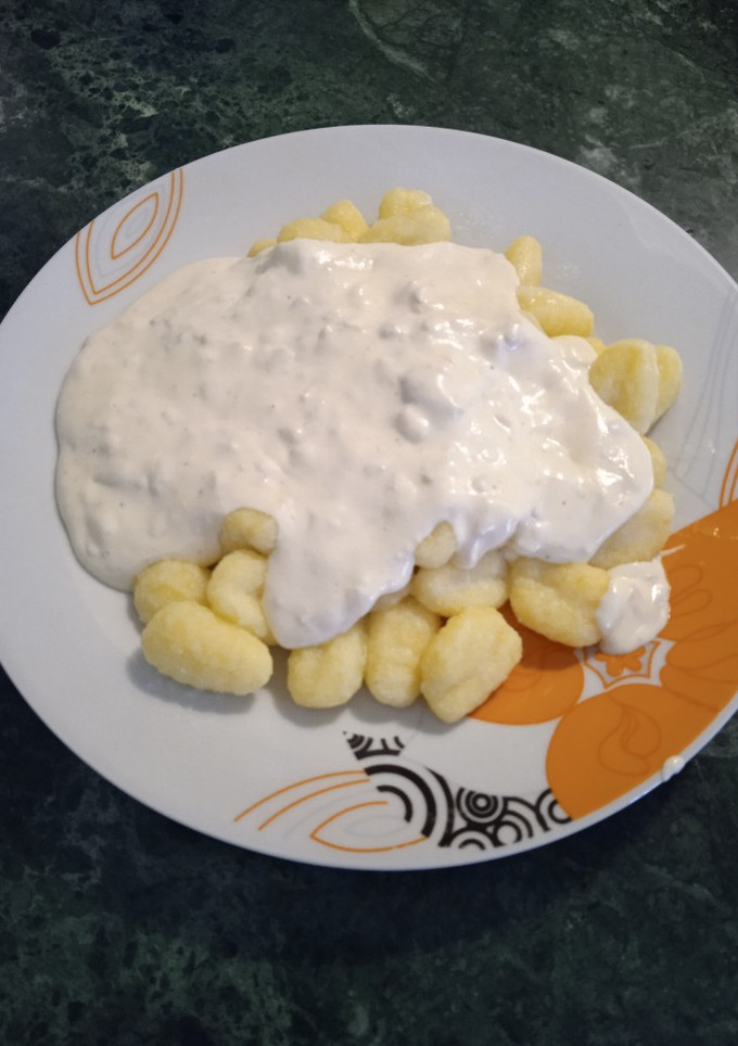 Una foto de Ñoquis en salsa de cuatro quesos con nueces