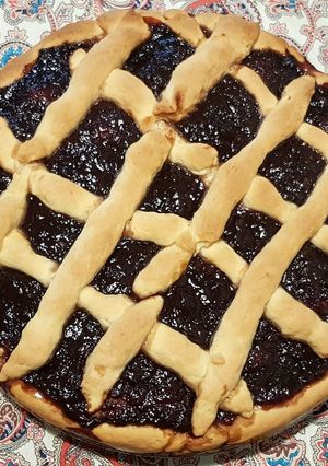 A picture of Greek Pasta Flora or else sweet jam pie.