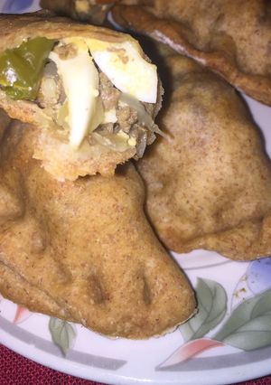 Una foto de Empanadas Caseras y al Horno: Masa Integral - Relleno de Carne, Morrón Verde, Cebolla y Huevo