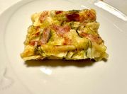 Una foto di prosciutto cotto besciamella e zucchine