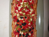 Coca de hojaldre con calabacín y pimientos