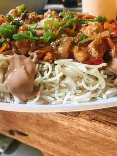 A picture of Singaporean rice with gravy sauce.
