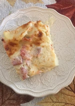Una foto de Papas gratinadas con salsa de queso
