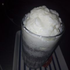 A picture of Home made vanilla ice cream with some chocolate chips.