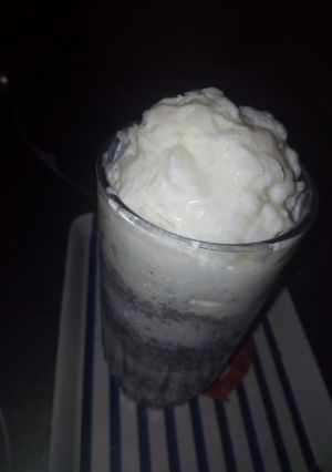 A picture of Home made vanilla ice cream with some chocolate chips.