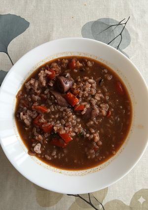 Una foto de Arroz caldoso con chipirones y agua de cocción de pulpo
