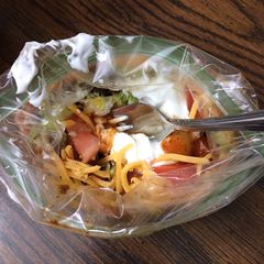 A picture of Taco in a bag.