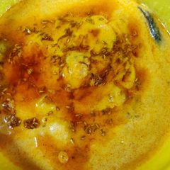 A picture of Punjabi kadhi combo of kadhi chawal is very popular and very tasty.