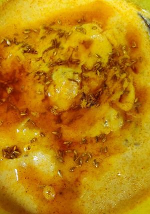 A picture of Punjabi kadhi combo of kadhi chawal is very popular and very tasty.