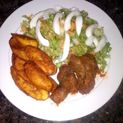 A picture of Fried plantain and simple salad.