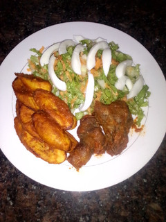 A picture of Fried plantain and simple salad.