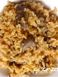 Una foto de Arroz con asadura de cordero