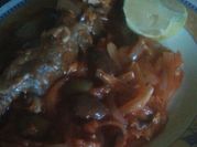 Una foto de filete de pescado aceituna