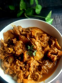 খাসির মাথার মাংস ভূণা। রেসিপির প্রধান ছবি