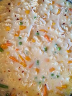 A picture of Creamy chicken and noodle soup.