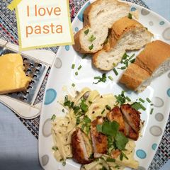 A picture of Fettuccine Alfredo with tikka chicken.