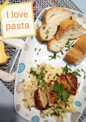 A picture of Fettuccine Alfredo with tikka chicken.