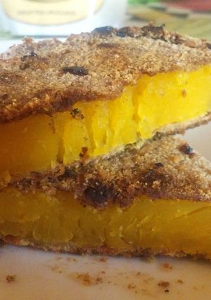 Una foto de Milanesas de calabaza y de papa
