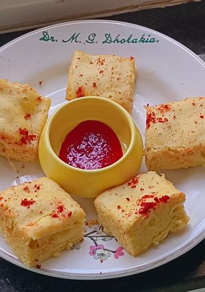 A picture of Crimson Glow Dhokla – Oil-Free Steamed Snack‌ with Red chilli Jam.
