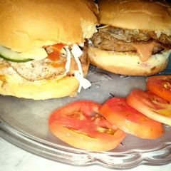 A picture of Chicken burger with fusion sauce.