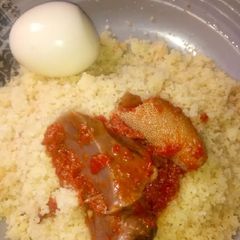 A picture of White couscous with stew.