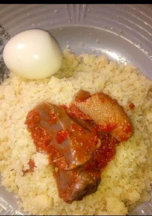 A picture of White couscous with stew.