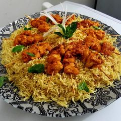 A picture of #CookpadApp Tomato pulao with bbq skewers.