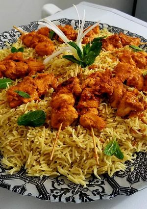 A picture of #CookpadApp Tomato pulao with bbq skewers.