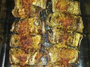 Una foto de berenjena rollos