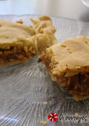 A picture of Eggplant pie with onions and anthotyro.