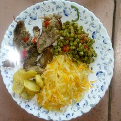 A picture of Baked potatoes and goat meat with veges.