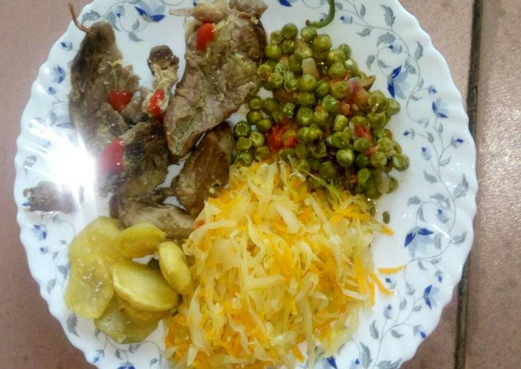 Baked potatoes and goat meat with veges