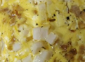 Una foto de Quiche de palmitos, poro caramelizado y queso de cabra