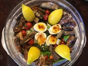 A picture of sardines in tomato sauce