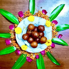 A picture of Gulab Jamun with dry fruits for special celebration.