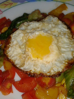 A picture of Roasted veggies with sunshine egg.
