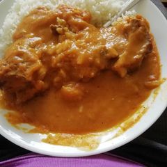 A picture of Rice and pumpkin soup.