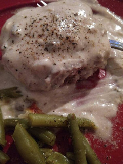 A picture of Hamburger patties in mushroom sauce.