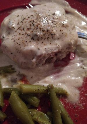A picture of Hamburger patties in mushroom sauce.