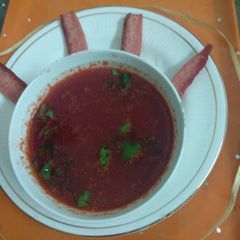 A picture of Tomato bottle gourd soup.