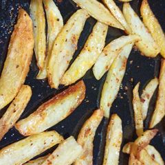 A picture of Baked Garlic Potato wedges.