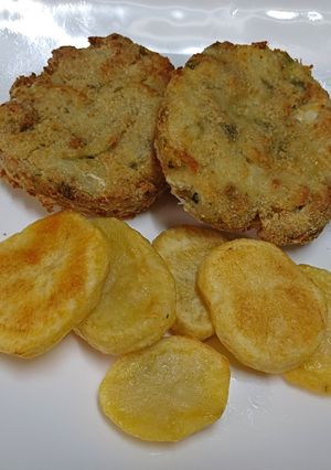 Una foto de Medallones de merluza al horno con papas