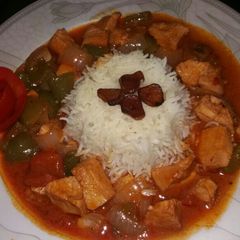 A picture of Garlic rice with chicken shashlik.