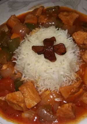 A picture of Garlic rice with chicken shashlik.