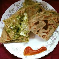 A picture of Matar paneer and cheese paratha.