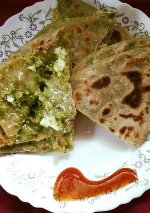 A picture of Matar paneer and cheese paratha.