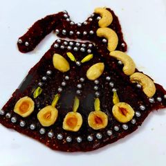 A picture of Dates And Figs Chaniya Choli Cake.