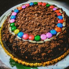 A picture of Chocolate cake topped with chocolate crumbs.