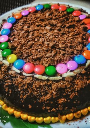 A picture of Chocolate cake topped with chocolate crumbs.